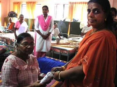 Distributing clothes to mahilamandiram inmates